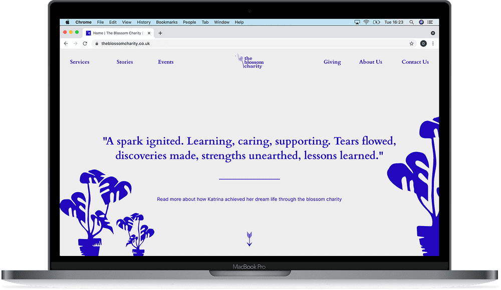 the blossom charity website example on a laptop